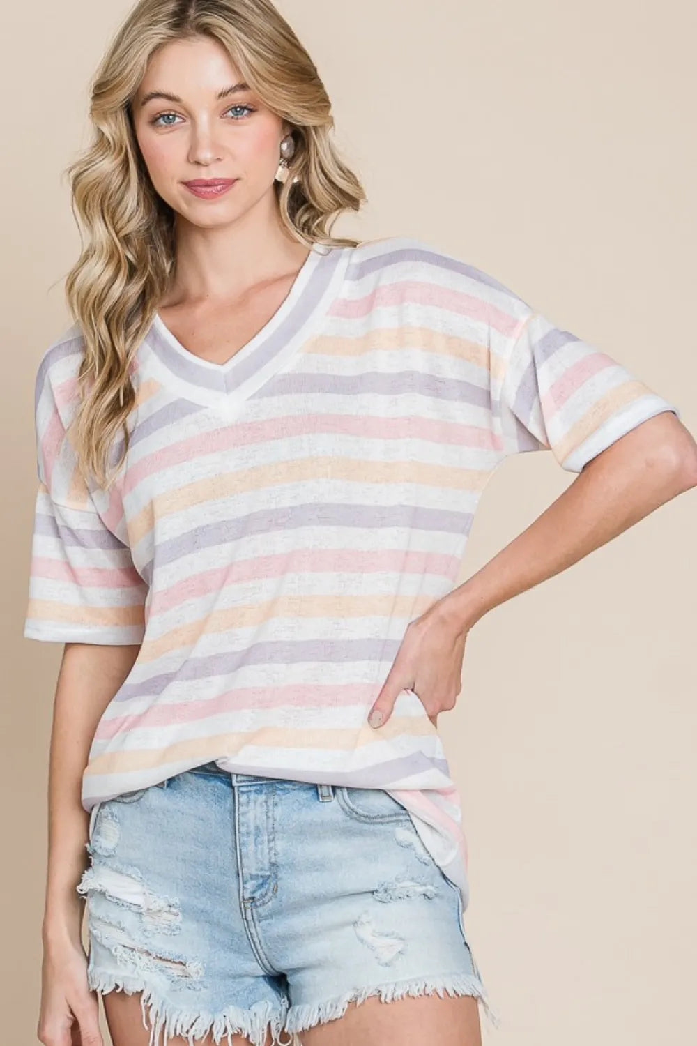 Model with hand on hip wearing BOMBOM striped V‑neck short sleeve T‑shirt