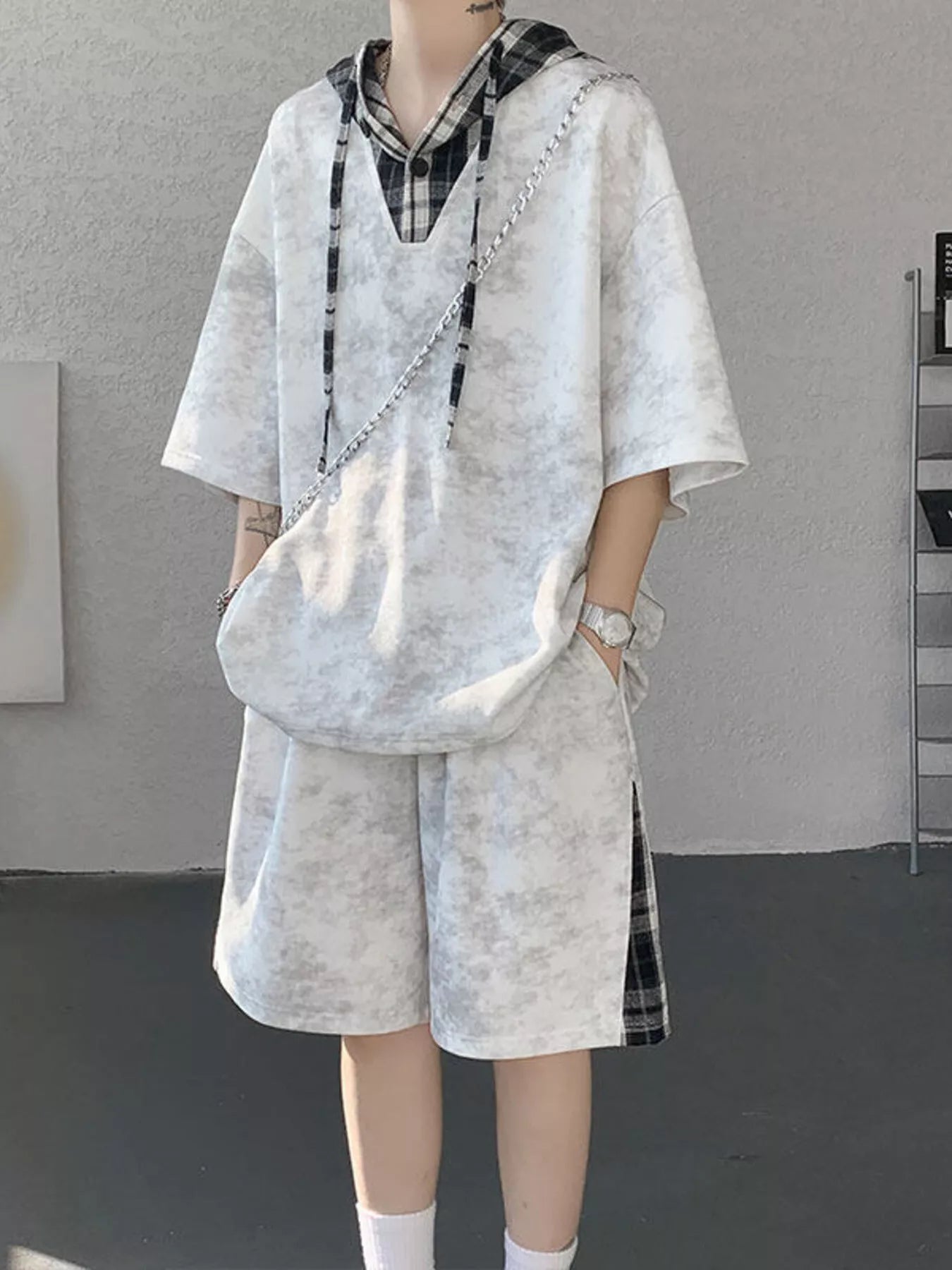 Men's Plus Size Tie-Dye Plaid Patchwork Hoodie and Shorts Set on a model in a stylish indoor setting.