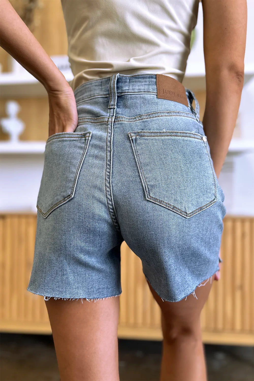 Judy Blue High Waist Raw Hem Denim Shorts Small back view with pockets and raw hem