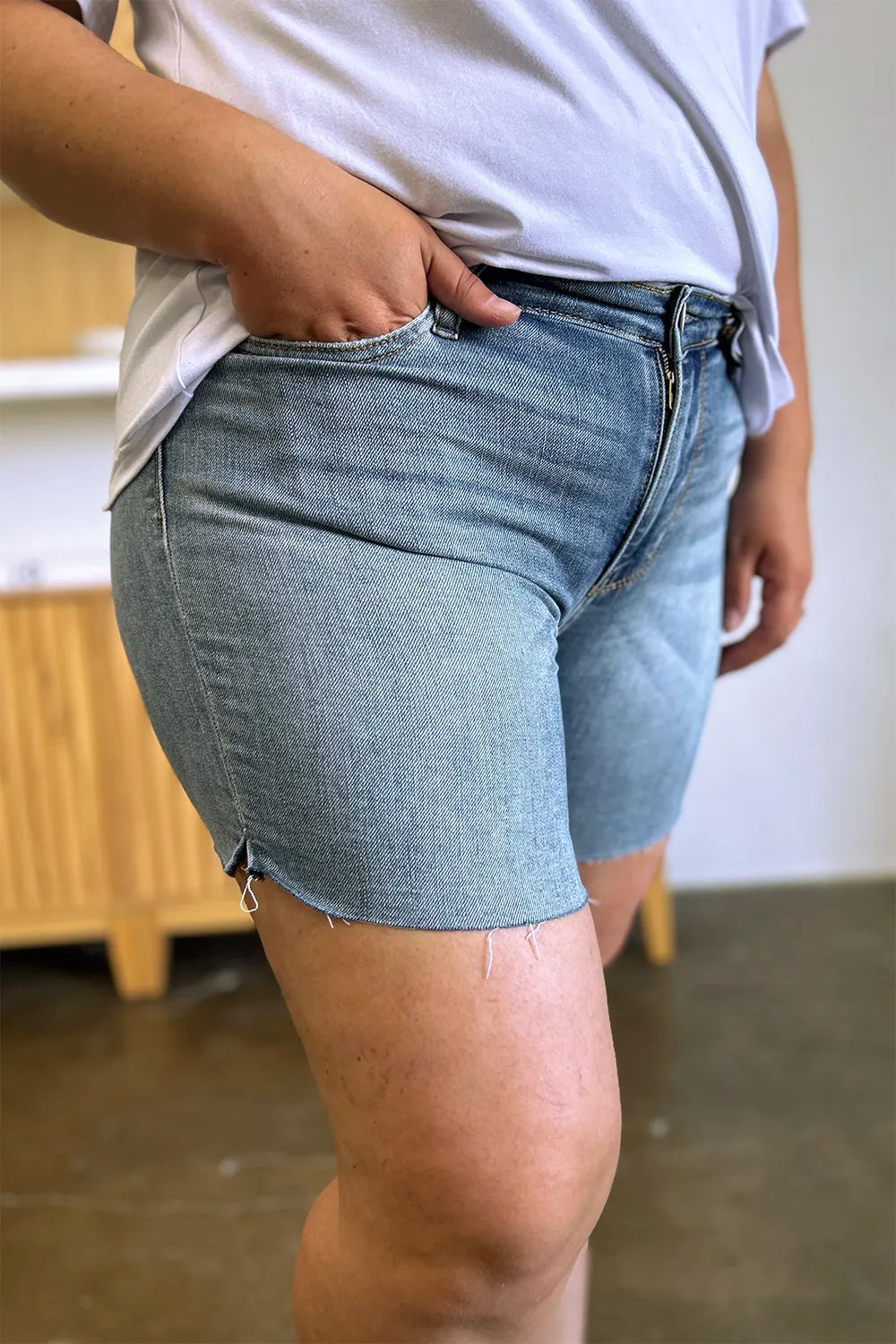 Judy Blue High Waist Raw Hem Denim Shorts Small side view showing fit and rise