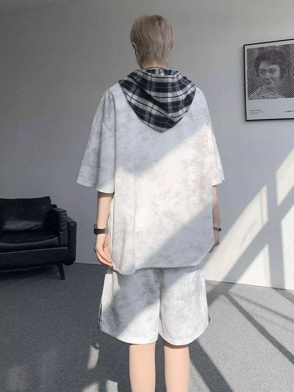 Men's Plus Size Tie-Dye Plaid Patchwork hoodie and shorts set displayed from the back in a stylish indoor setting.